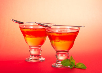 Two glasses of jelly with spearmint leaf