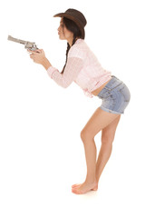 woman pink plaid shirt gun lean forward side