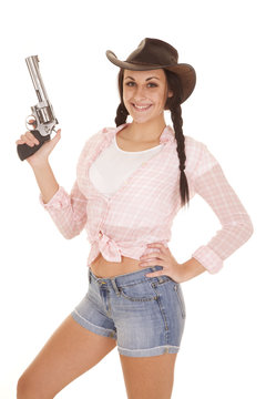 woman pink plaid shirt gun up smile
