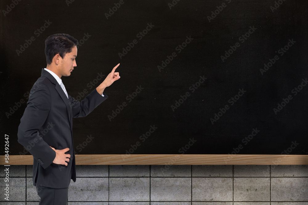 Aufkleber composite image of unsmiling asian businessman pointing