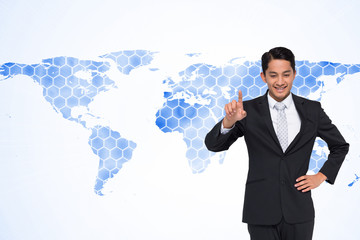 Composite image of smiling asian businessman pointing