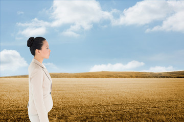 Composite image of unsmiling asian businesswoman