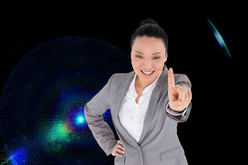 Composite image of smiling asian businesswoman pointing