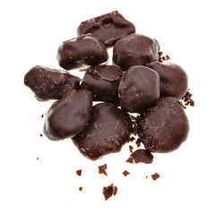 candies of dried plum in dark chocolate