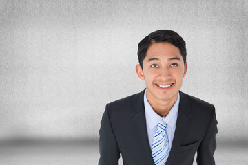 Composite image of smiling asian businessman