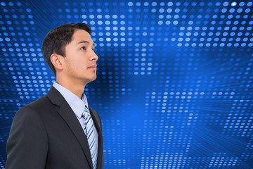 Fototapeta premium Composite image of serious asian businessman