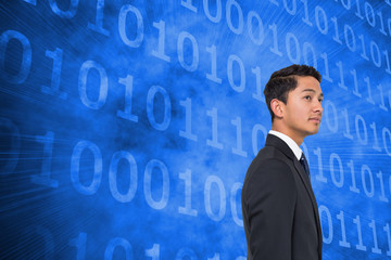 Composite image of serious asian businessman