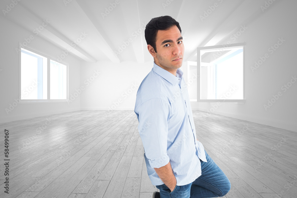 Poster Composite image of unsmiling casual man standing