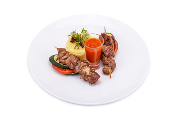 Grilled meat and vegetables with sauce