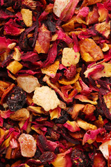aromatic dry tea with fruits and petals, close up