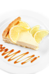 Slice of  lemon cheesecake  and sauce