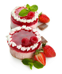 Delicious berry cakes isolated on white