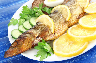 Smoked fish on plate close up