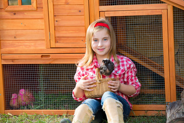 breeder hens kid girl rancher farmer with chicks in chicken coop