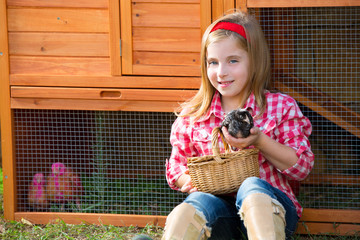 breeder hens kid girl rancher farmer with chicks in chicken coop © lunamarina
