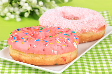 Sweet donuts on table close-up