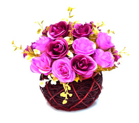 artificial flowers in basket isolate on white