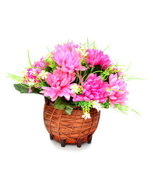 artificial flowers in basket isolate on white