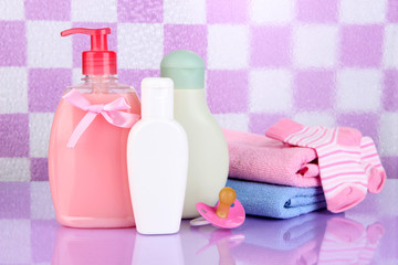 Baby cosmetics and towels  in bathroom