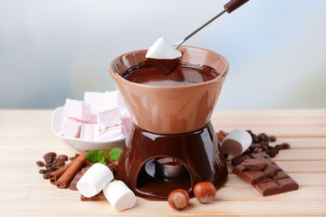 Chocolate fondue with marshmallow candies,