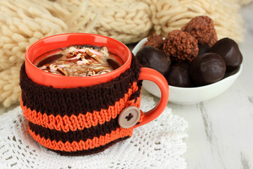 Cup with knitted thing on it close up