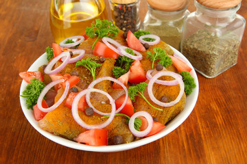 Turkey meat in bowl on wooden table close up