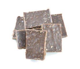 Broken milk chocolate bar isolated on white background