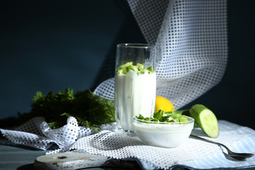 Cucumber yogurt in glass and bowl,