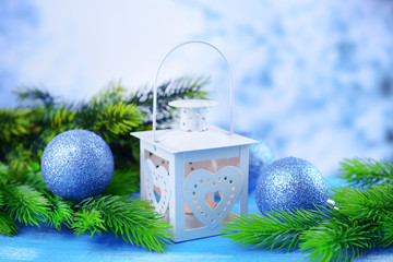 Christmas lantern, fir tree and decorations  on light