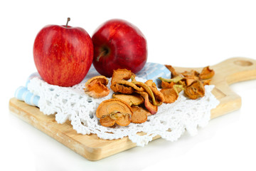 Dried apples and fresh apples,on cutting board isolated on