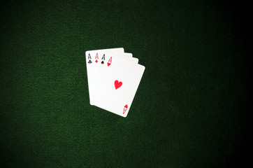 4 aces on green background