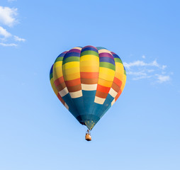 Colorful hot air balloon with blue sky background