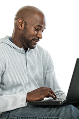 Handsome black man on laptop computer