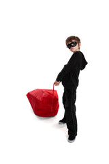 Child stealing Santa's Christmas sack
