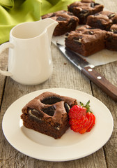 Chocolate brownie cake with strawberries.