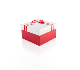 red and white present wrap by ribbon