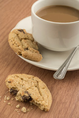 A cup of coffee and cookie