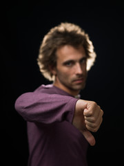 man in purple shirt down gesture in focus