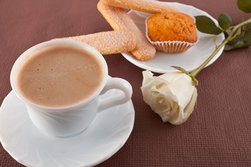 Obraz na płótnie Canvas cup of coffee and cookies, flower