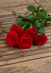 bouquet of red roses on table