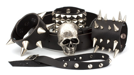 Rock style leather belt and bracelet isolated on white backgroun