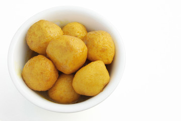 top view curry flavor fish balls in bowl with clipping path