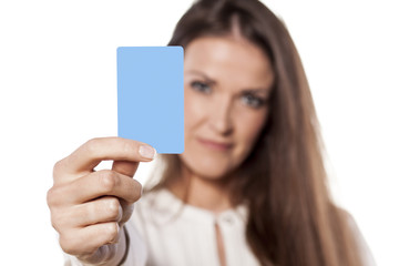young business woman hold in her hand blank credit card
