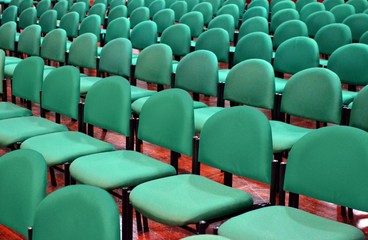 Fototapeta premium Rows of Green Chairs in a Seminar Hall