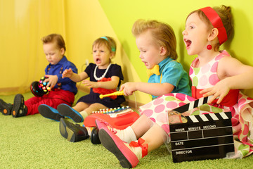 Four mods children sit at the bright wall