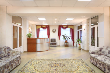 Light hallway with sofas and reception area