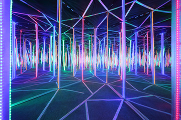 Mirror labyrinth lit with bright multicolored light