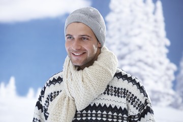 Winter portrait of happy young man