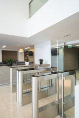 Security turnstiles at business center in modern style