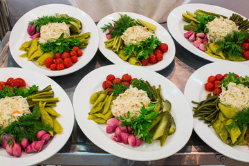 Snacks of marinated vegetables on a tray